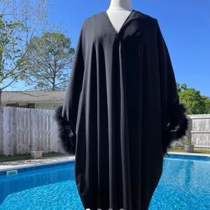 Gorgeous 1970s black kaftan with feather plume sleeves